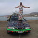 Illustration for article titled Groovalicious Purple Princess Of Peace Art Car Falls On Hard Times, Faces Crusher